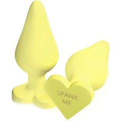  Жёлтая анальная пробка с сердечком в основании NAUGHTY CANDY HEART SPANK ME 8,8 см 