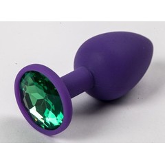  Фиолетовая силиконовая анальная пробка с зеленым стразом 7,1 см 