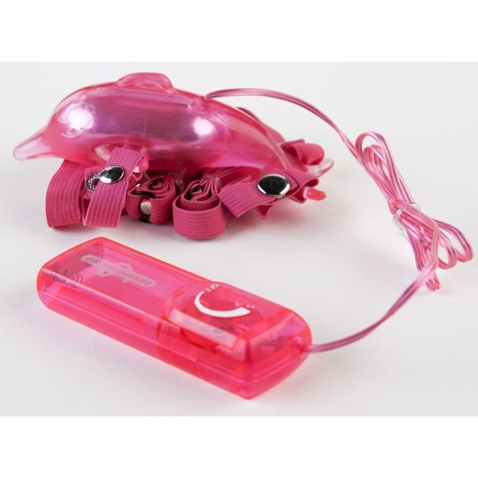 Розовый вибростимулятор в форме дельфина на регулируемых ремешках. Фотография 2.