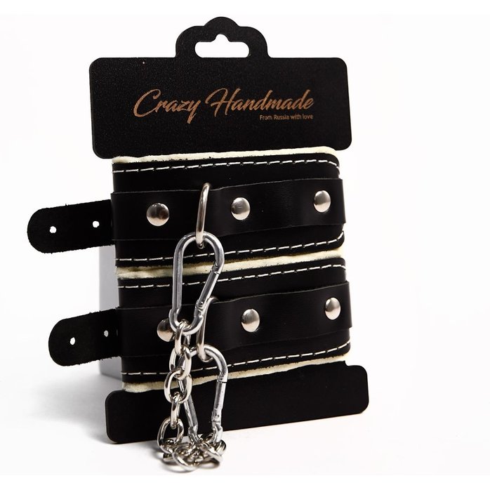 Черные скругленные наручники с мягкой бежевой подкладкой. Фотография 2.