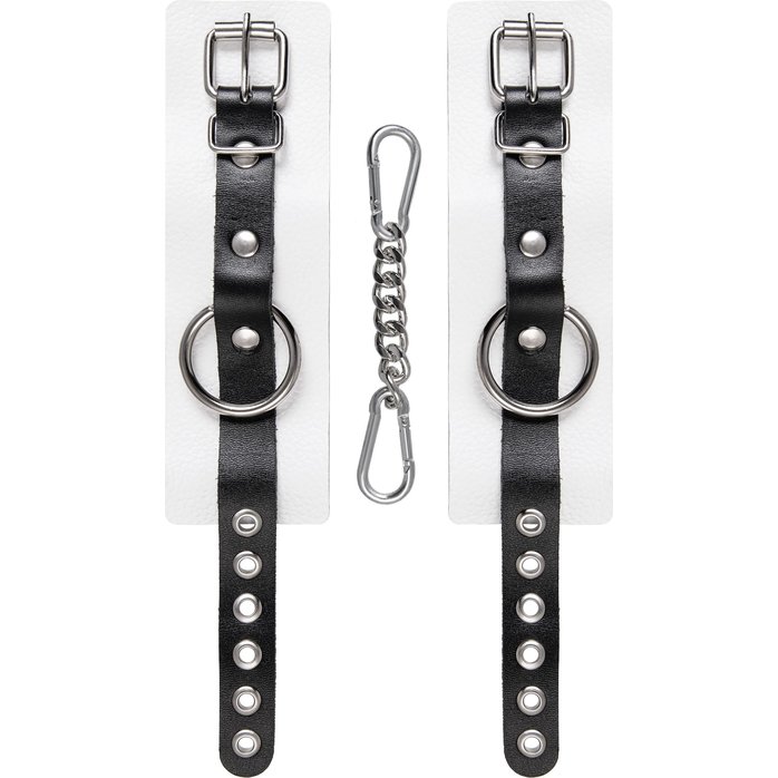 Бело-черные кожаные наручники с одним ремешком с люверсами. Фотография 4.