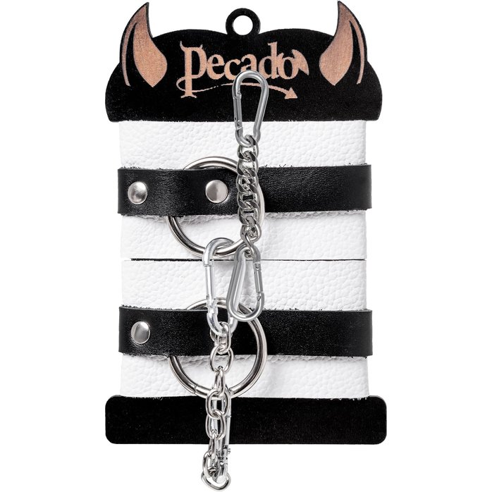 Бело-черные кожаные наручники с одним ремешком с люверсами. Фотография 5.