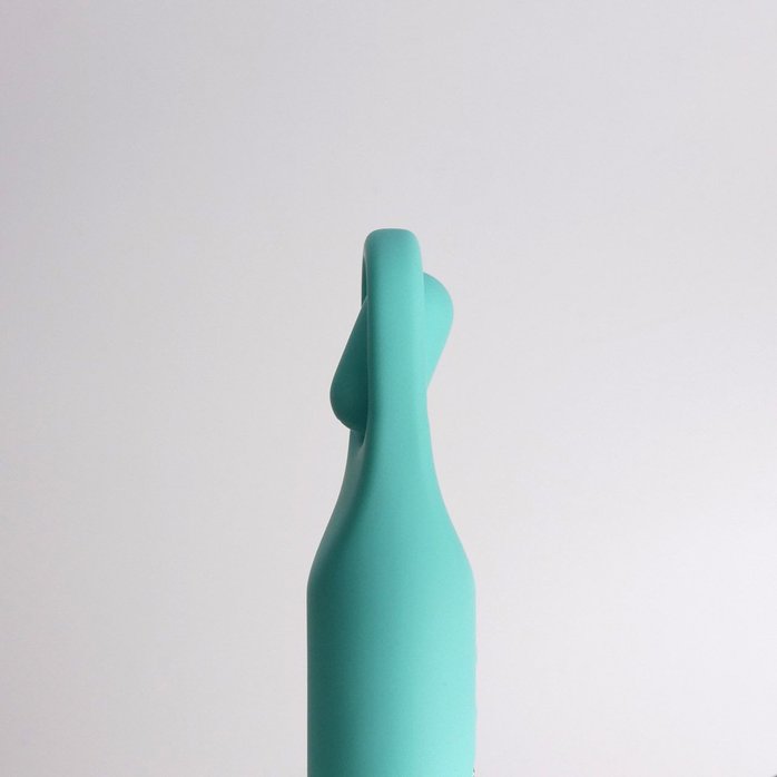 Бирюзовая многофункциональная вибропуля с щеточкой. Фотография 5.