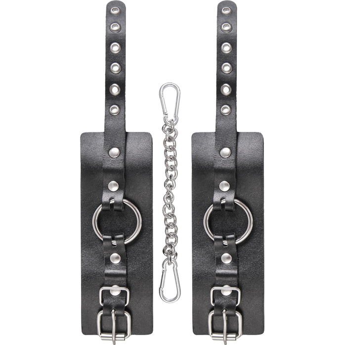 Черные наручники из толстой натуральной кожи с люверсами. Фотография 5.