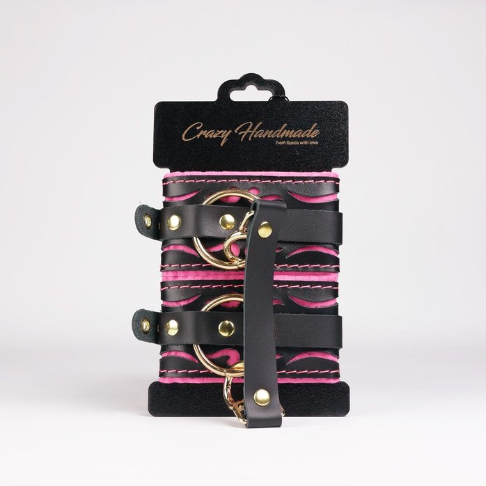 Черные кожаные оковы с розовой строчкой. Фотография 2.