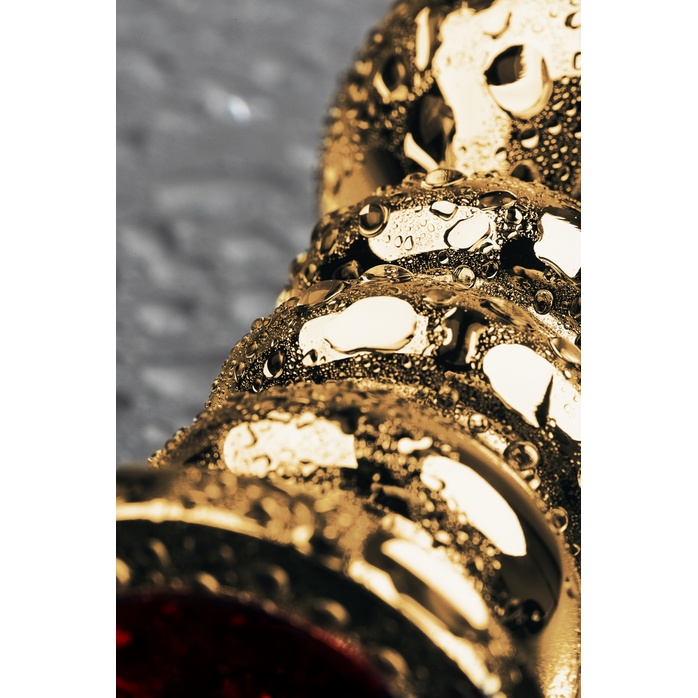 Золотистый анальный плаг с рёбрышками и красным кристаллом - 10,5 см - Metal. Фотография 6.