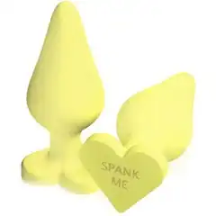  Жёлтая анальная пробка с сердечком в основании NAUGHTY CANDY HEART SPANK ME 8,8 см 