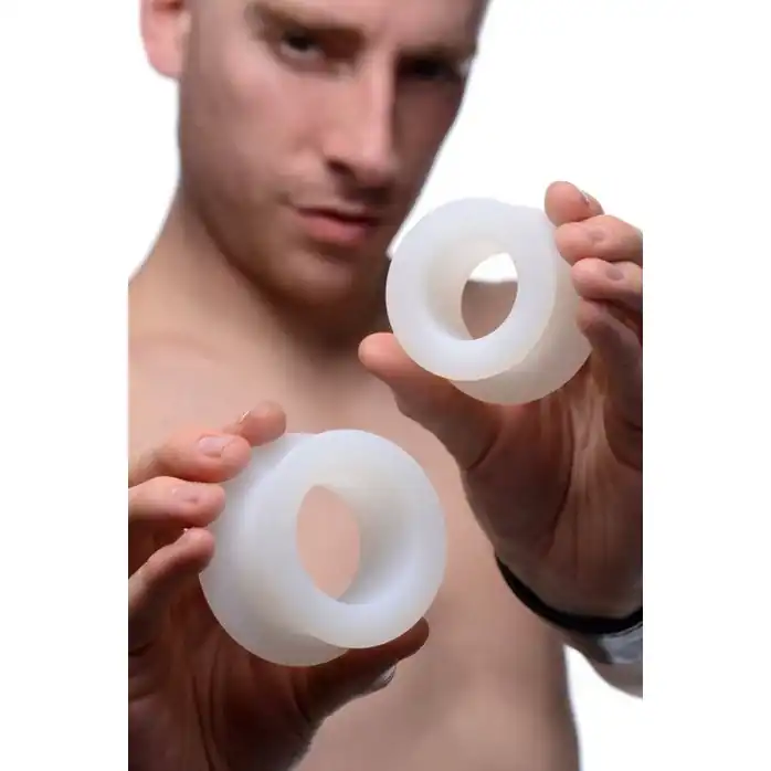 Набор из 2 белых анальных расширителей Stretch Master 2 Piece Training Silicone Ass Grommet set - Master Series. Фотография 5.