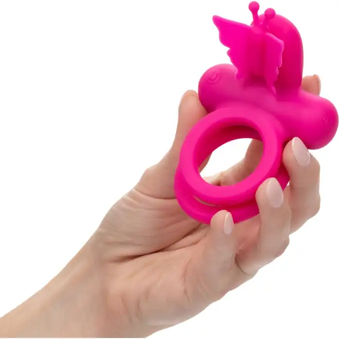 Розовое эрекционное виброкольцо Silicone Rechargeable Dual Butterfly Ring - Couples Enhancers. Фотография 3.